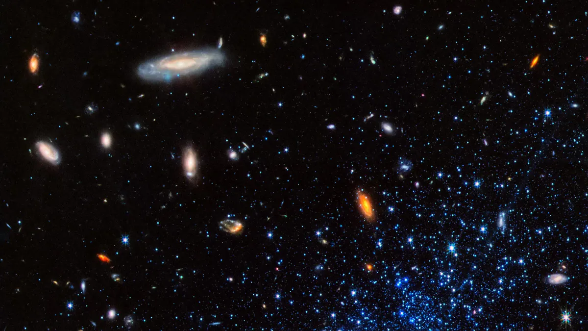 Illustration of distant galaxies against a dark field of stars