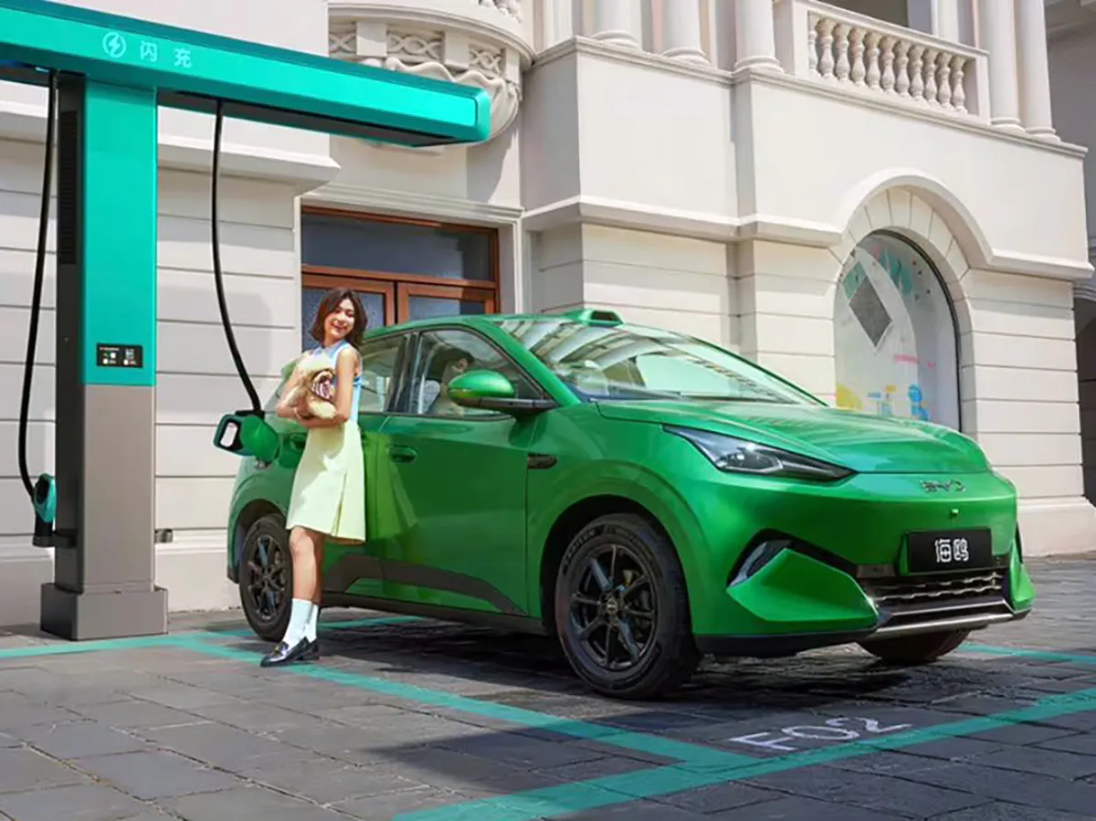 An electric car connected to a charging station