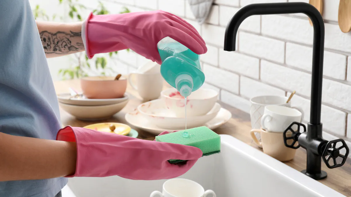 Folded towels and cleaning supplies in a rental apartment