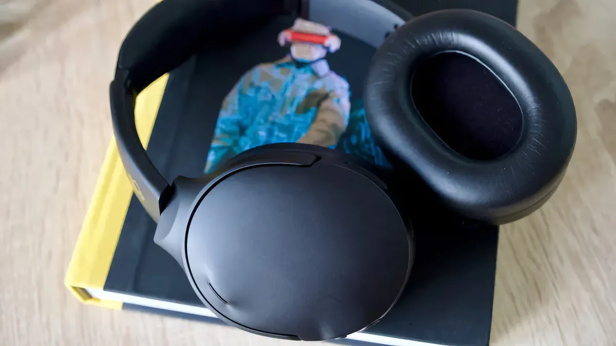 Over-ear headphones resting on a desk