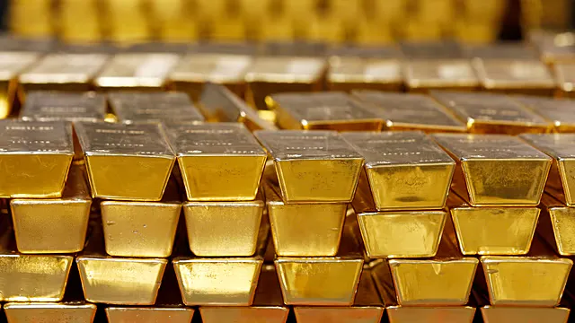 Gold bars arranged in a vault