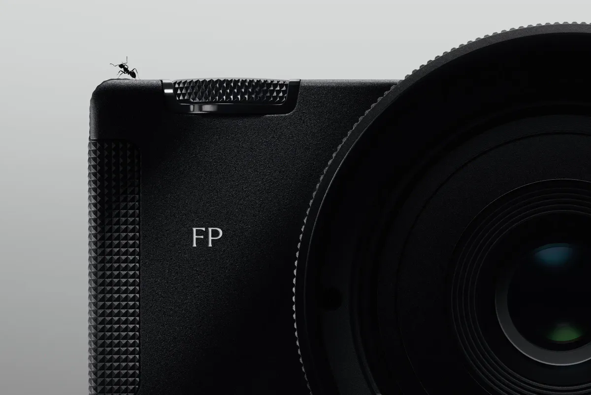 A compact interchangeable-lens camera with a rear screen