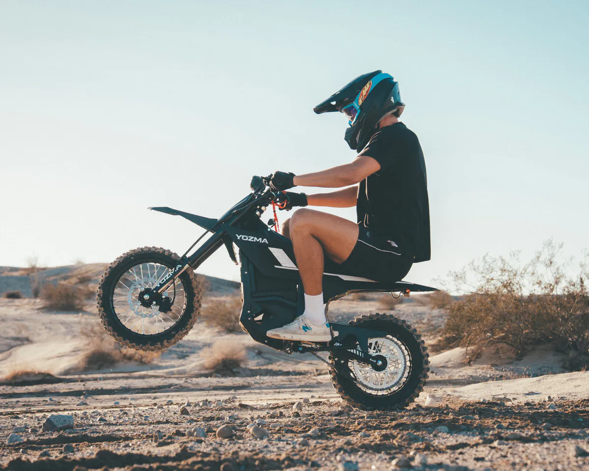 Illustration of an electric dirt bike on an off-road trail