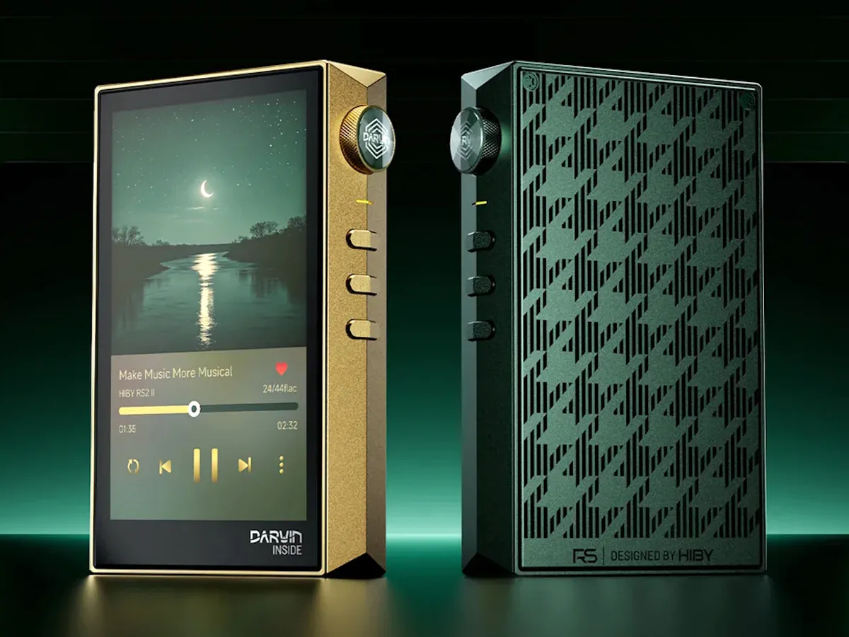 Portable digital audio player beside wired headphones and microSD cards