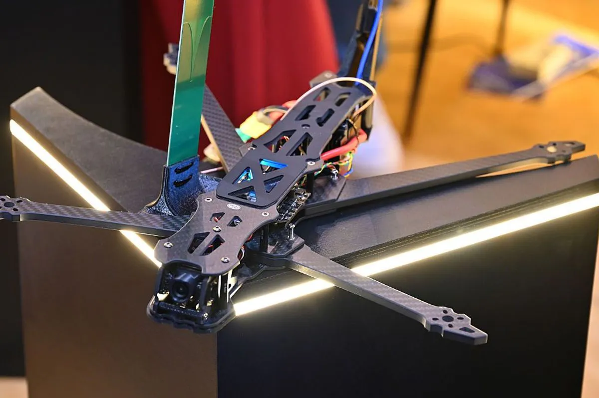 Drone components and electronic circuit boards on a laboratory workbench