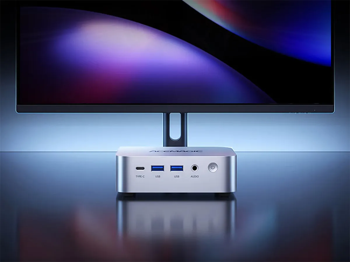 Illustration of a compact desktop computer with USB and display connections