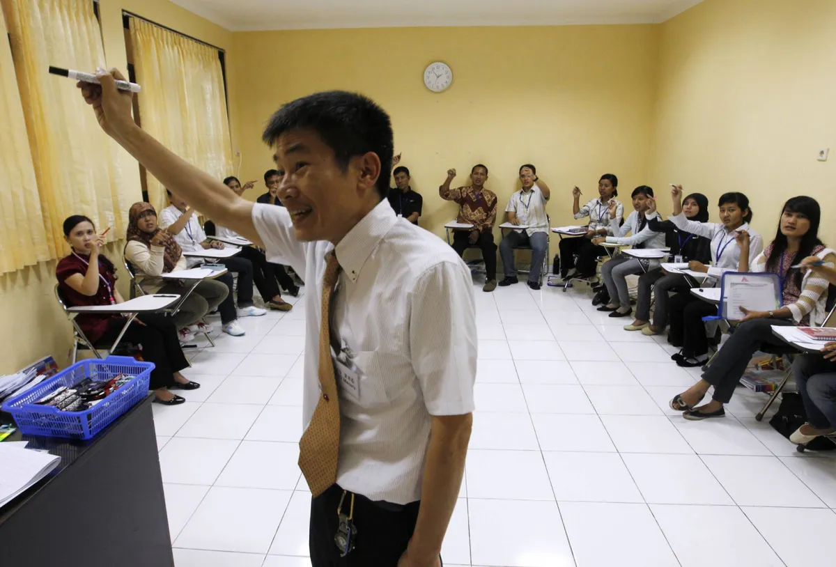 Desks and a whiteboard in a language classroom