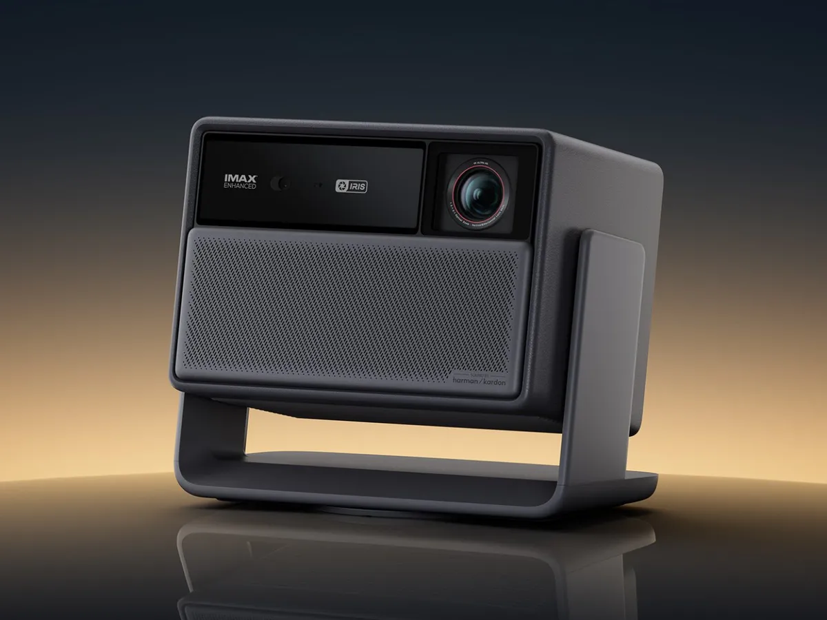 A home theater projector facing a projection screen
