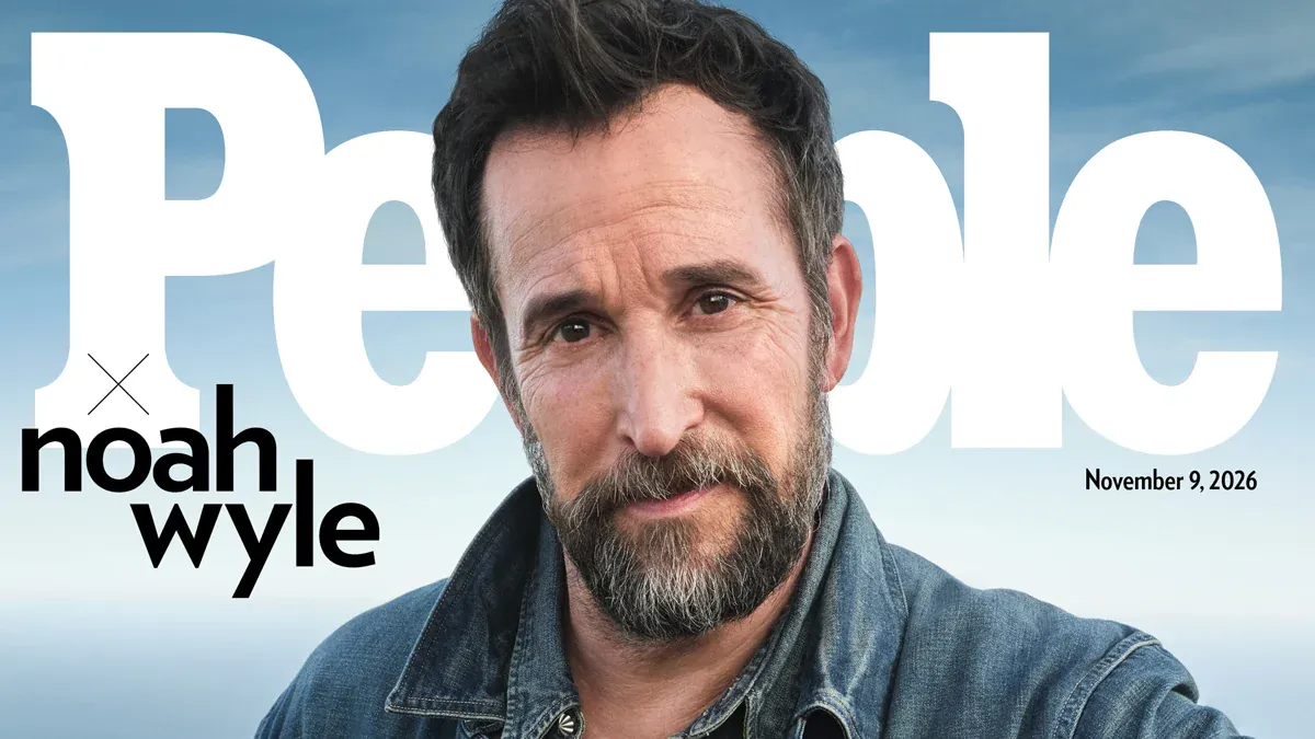 A magazine resting on a table beside studio lighting