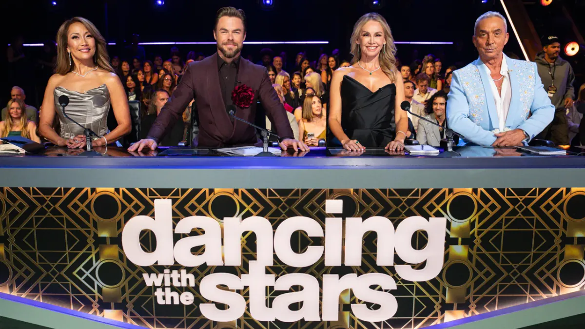 A ballroom dance floor under theatrical lighting