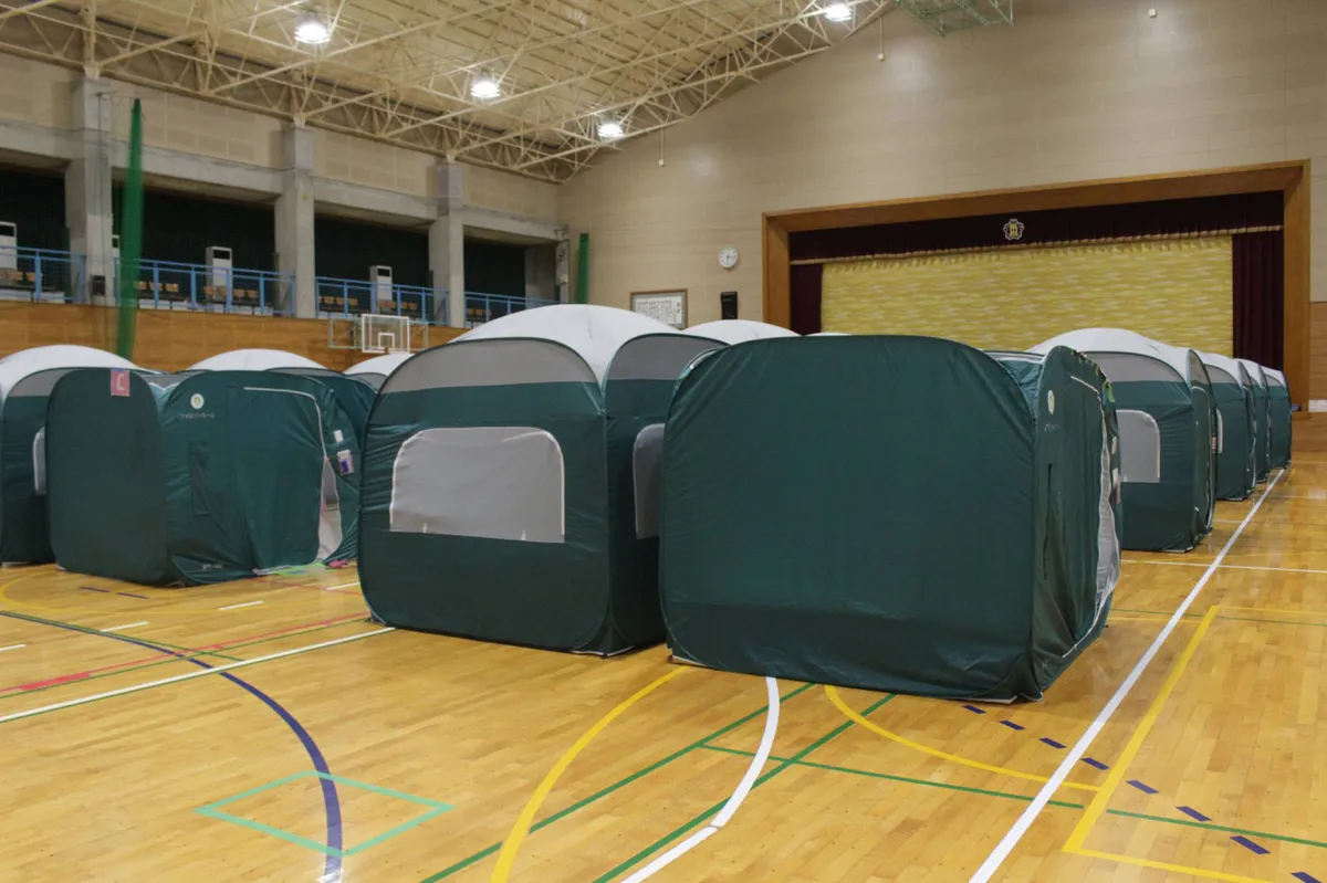Temporary housing units beside a residential neighborhood