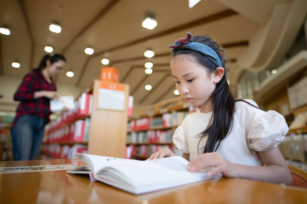 Children’s books arranged on library shelves