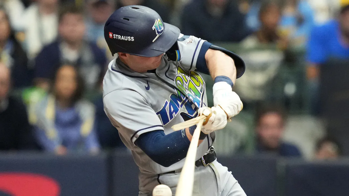 Baseball and glove on an infield