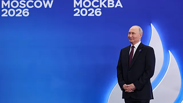 Conference table with microphones and national flags