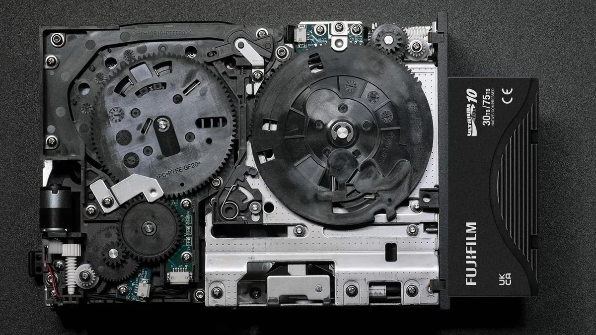 Magnetic tape cartridges arranged beside a data storage drive