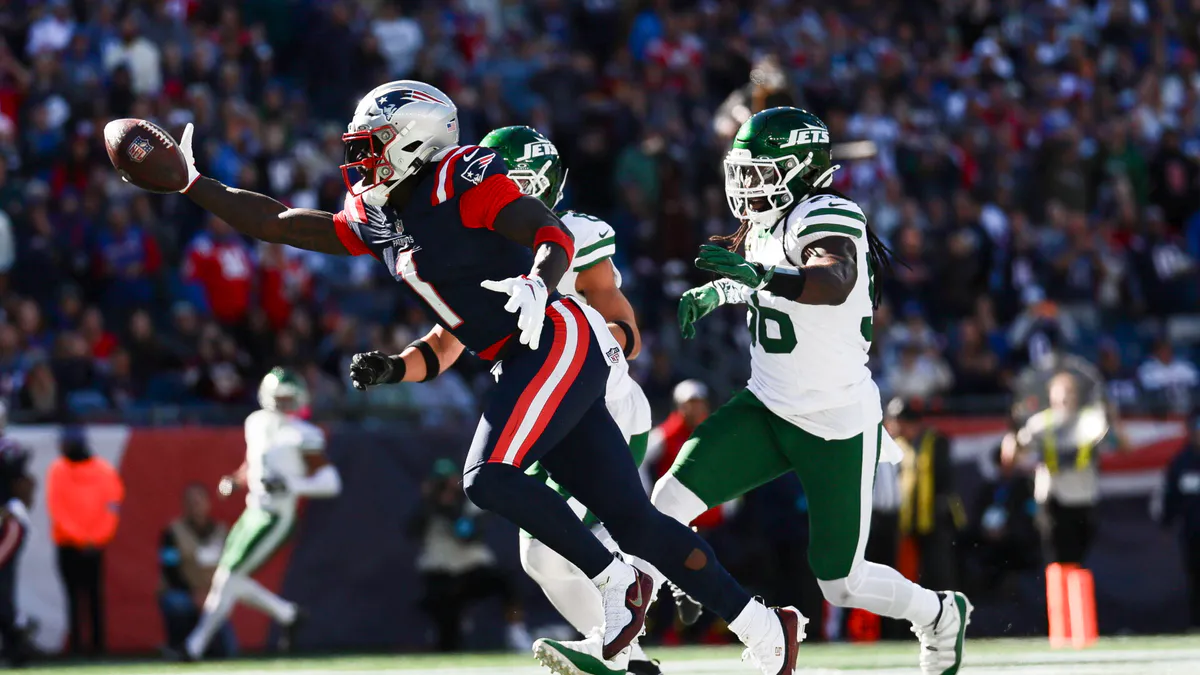 An American football on a marked field