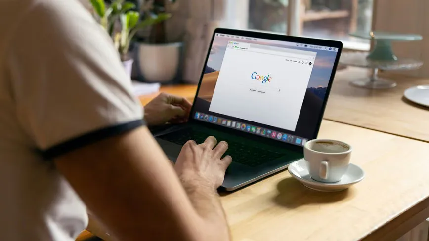 Computer screen displaying code beside a browser window