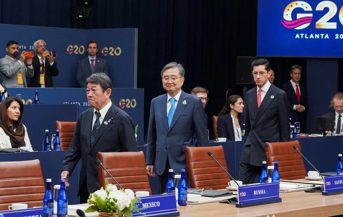 Japanese and Russian flags displayed beside a conference table