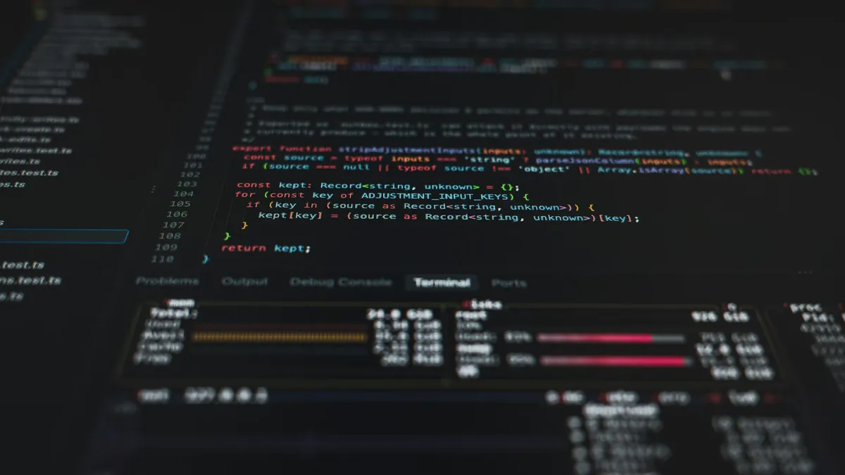 Computer screen displaying code beside a cybersecurity lock symbol